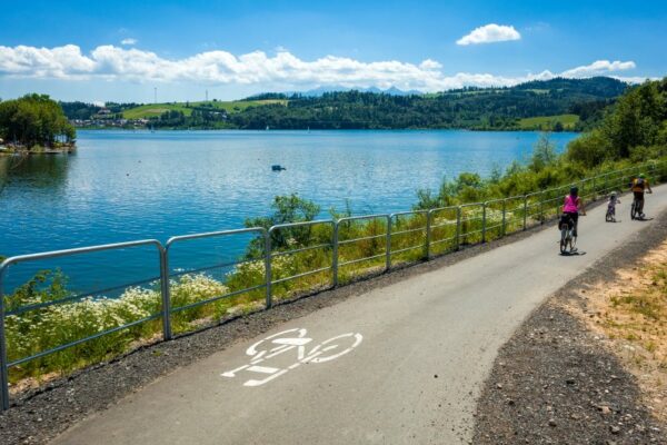 Family Cycling around Czorsztynskie lake near Niedzica village o
